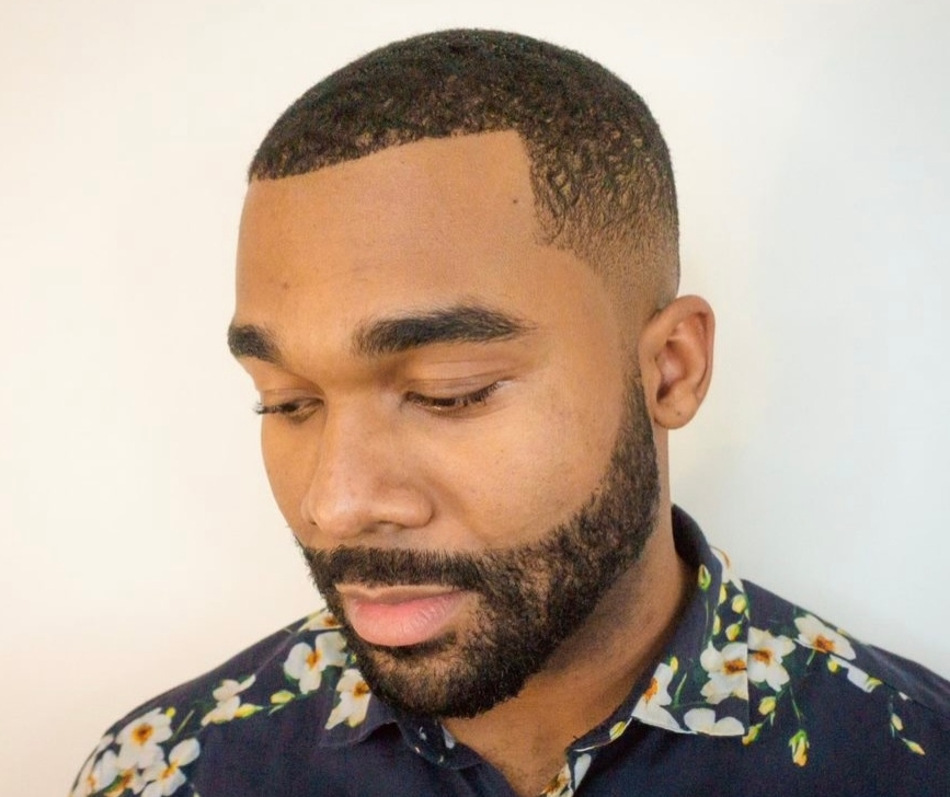 African American male with low fade haircut and detailing around the edge of the face by Andis.